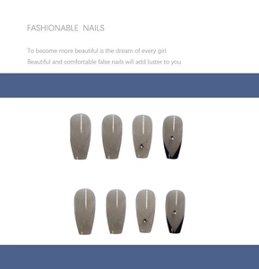 Detail of blue and grey ballet fake nails with silver lines and crystal rhinestones