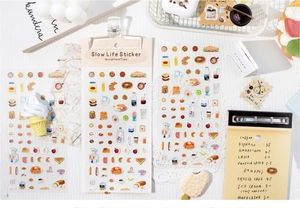 Flat lay of hand-drawn breakfast stickers featuring coffee and waffles for DIY planners