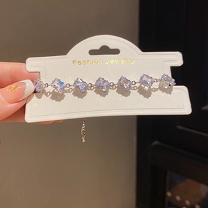 Close-up of crystal bracelet with rectangular stones and adjustable silver chain