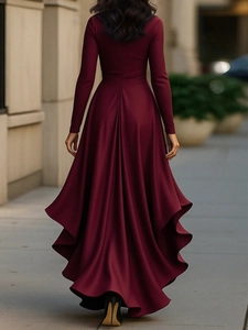 Detailed back view of burgundy satin V-neck dress with layered ruffle hem and flowing train