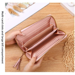 Detail view of pink long wallet with multiple card slots and spacious banknote compartments