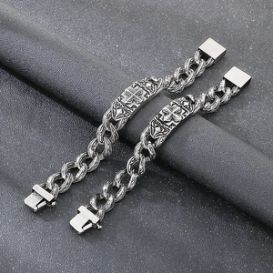 Vintage silver-tone titanium steel bracelet with engraved cross pattern and toggle clasp