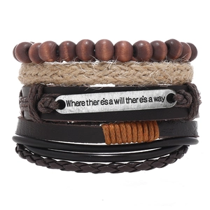 Macro shot of brown leather bracelet set with metal tag Where there is a will there is a way