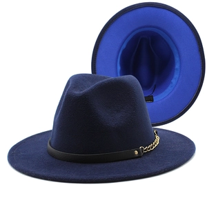 Detail of wool fedora with black leather band, gold chain and blue brim underside