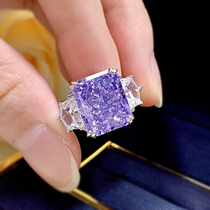 Three-stone ring with rectangle purple crystal and side stones on silver band