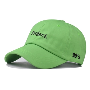 Close-up of green cotton baseball cap with Project embroidery and 90's side detail