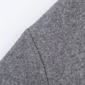 Macro shot of gray wool fabric texture and high-quality double-layer sewing detail