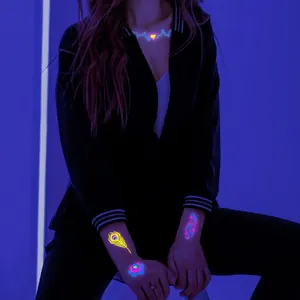 Neon glowing temporary tattoos with heart pulse and feather patterns for parties