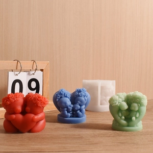 Macro shot of 3D bear family silicone mold and finished colored resin bear candles