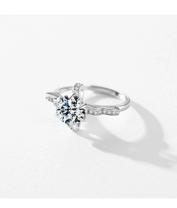 Macro shot of silver crown ring featuring a large round zircon and sparkling accents