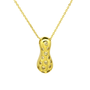 Macro detail of gold-plated peanut pendant with inlaid yellow cubic zirconia stones