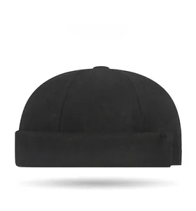 Side angle view of a black wool miki hat with warm ear protection for winter