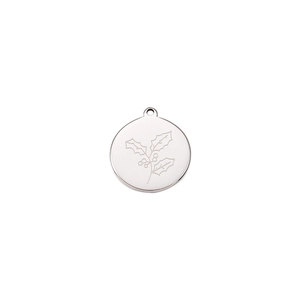 Macro detail of silver stainless steel pendant with holly leaf engraving and mirror finish