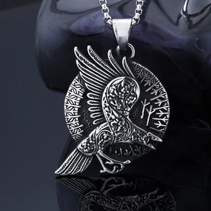 Detailed relief of Viking crow totem with Norse runes on stainless steel pendant