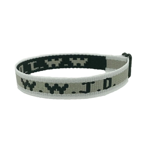 Macro shot of W.W.J.D. jacquard woven fabric wristband in beige and black pattern