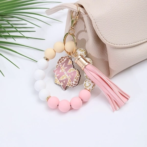 Silicone bead keychain with pink tassel, leopard print beads, and MAMA engraved charm