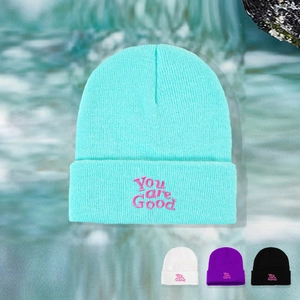 Detail of mint green beanie with You are Good embroidery showing color options