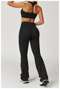 Rear view of black high-waisted flare leggings and sports bra set for fitness