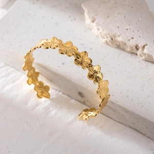 Elegant gold stainless steel open bangle with intricate ribbed flower design for women
