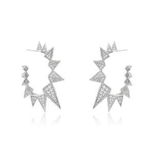 Detailed view of silver spike hoop earrings with pavé crystals and geometric design