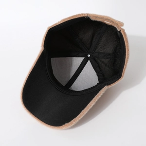 Detailed interior of plush camel baseball cap showing black lining and sturdy stitching