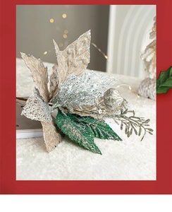 Detail of silver Christmas flower with sequins and burlap texture on plush white background
