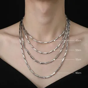 Titanium steel link chain necklace length guide showing 45cm to 60cm on a model silhouette