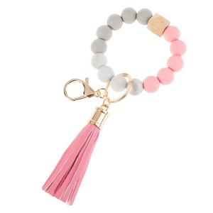 Silicone and wood bead keychain wristlet with pink leather tassel and gold metal hardware