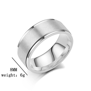 Detail shot of 8mm wide matte brushed stainless steel ring with polished edges