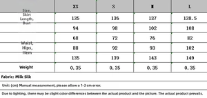 Detailed size chart with measurements for the elegant jewelry neck maxi dress in milk silk