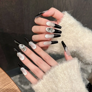 Luxury black and silver cat-eye press-on coffin nails with rhinestones and glitter details