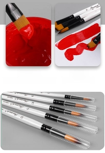 Macro detail of white acrylic paint brushes showing soft bristles and protective caps