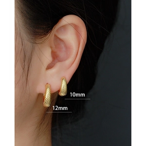 Textured 925 sterling silver hoop earrings in 10mm and 12mm sizes on model