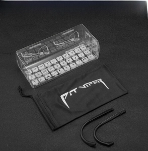 Detailed view of cycling eyewear accessories with black pouch and clear display box