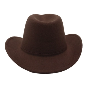 Close-up of dark brown felt cowboy hat with cattleman crease and stitched curved brim