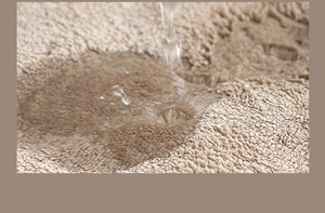 Macro shot showing high water absorption on the beige towel fabric of the kitchen apron