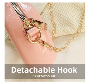 Detail of pink PVC jelly bag showing detachable gold chain and spring metal hook