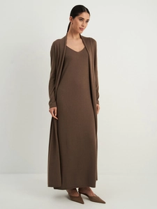 Detailed view of women's knitted long-sleeve cardigan and matching maxi dress set