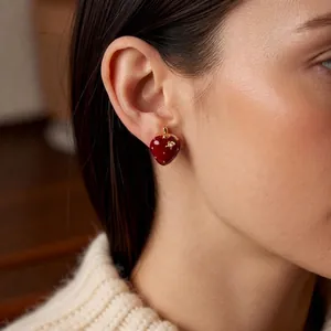 Elegant 18K gold plated strawberry stud earring with red enamel and zircon on female model