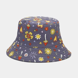 Detail of purple canvas bucket hat with hand-drawn flower and mushroom graffiti patterns