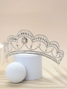 Detailed view of elegant silver bridal tiara with sparkling crystal rhinestones and wave design
