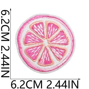 Macro detail of pink fruit slice embroidery patch with 6.2cm size measurement display