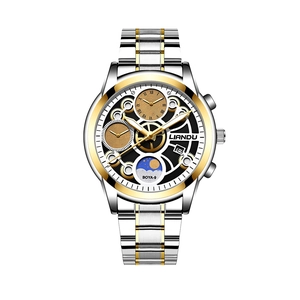 Close-up of two-tone stainless steel watch band and skeleton dial with moon phase display