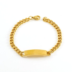 Detailed shot of polished gold Cuban link bracelet featuring a smooth ID plate and lobster clasp