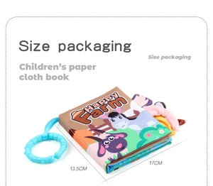 Close-up of Happy Farm cloth book showing 17x13.5cm size and plastic hanging ring
