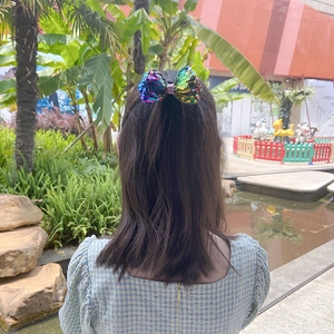 Sparkly sequin bow hair clip for girls with colorful gradient design for styling