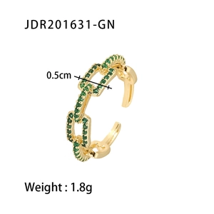 Detail view of 18K gold plated chain link ring with green cubic zirconia inlay