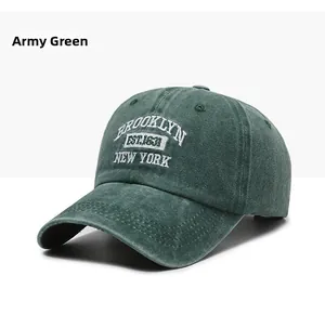 Detailed close-up of army green washed cotton baseball cap with Brooklyn embroidery