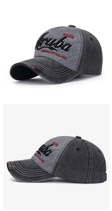 Detail of washed grey baseball cap with Aruba embroidery and quilted stitching patterns