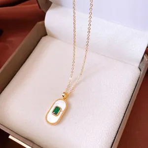 French vintage gold plated necklace featuring heart oval pendant with green gemstone